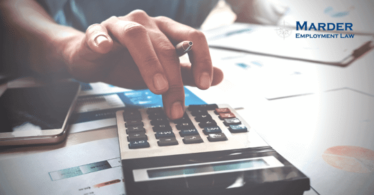 a person using a calculator