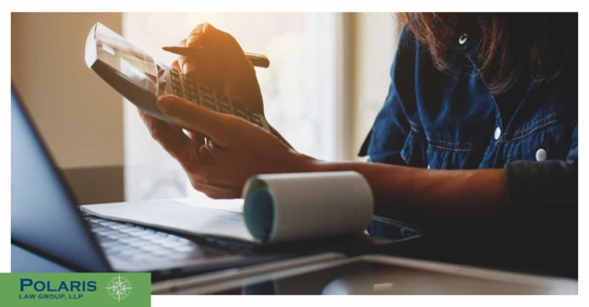 a woman using a calculator